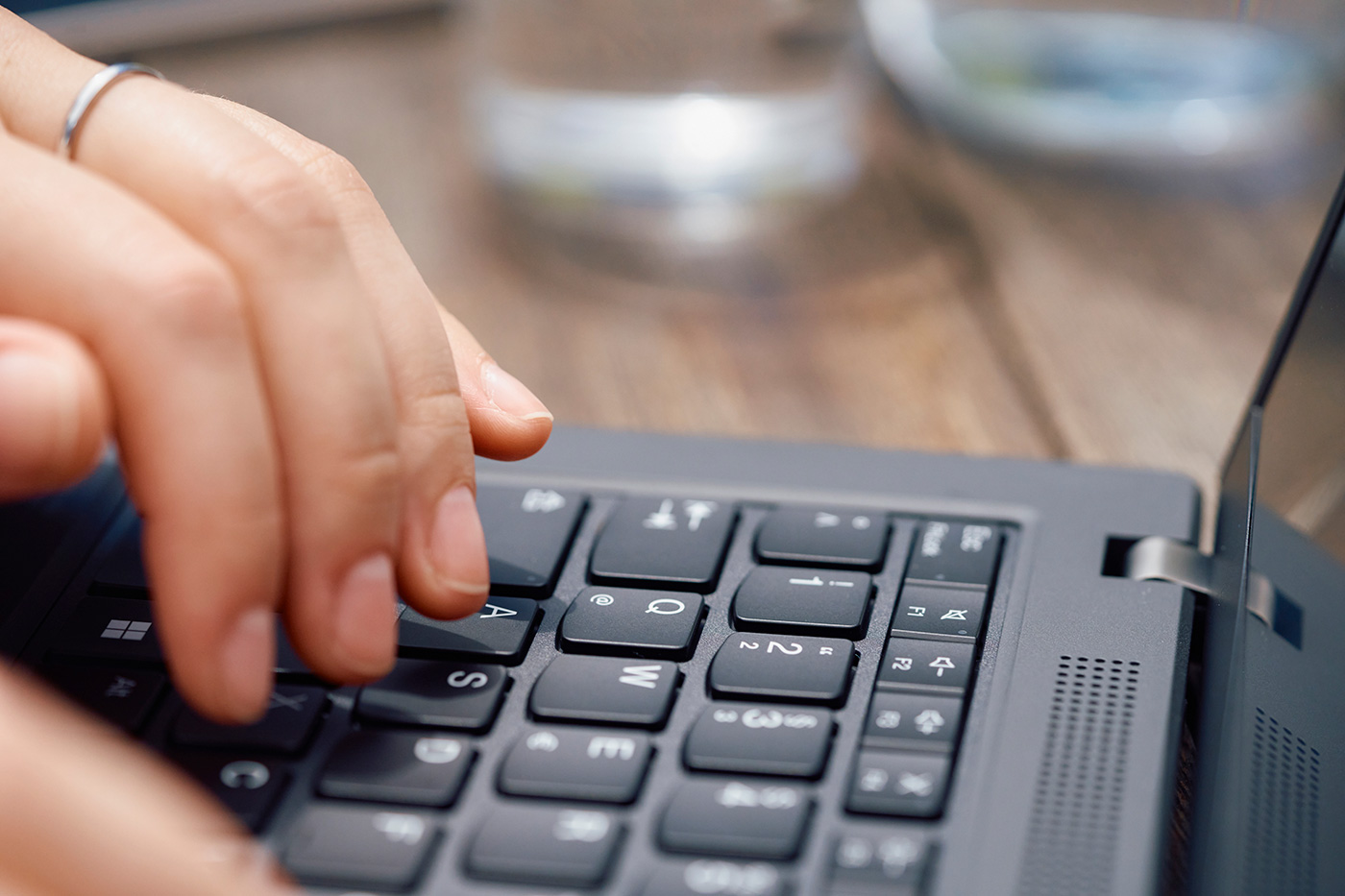 Hand typing on a keyboard