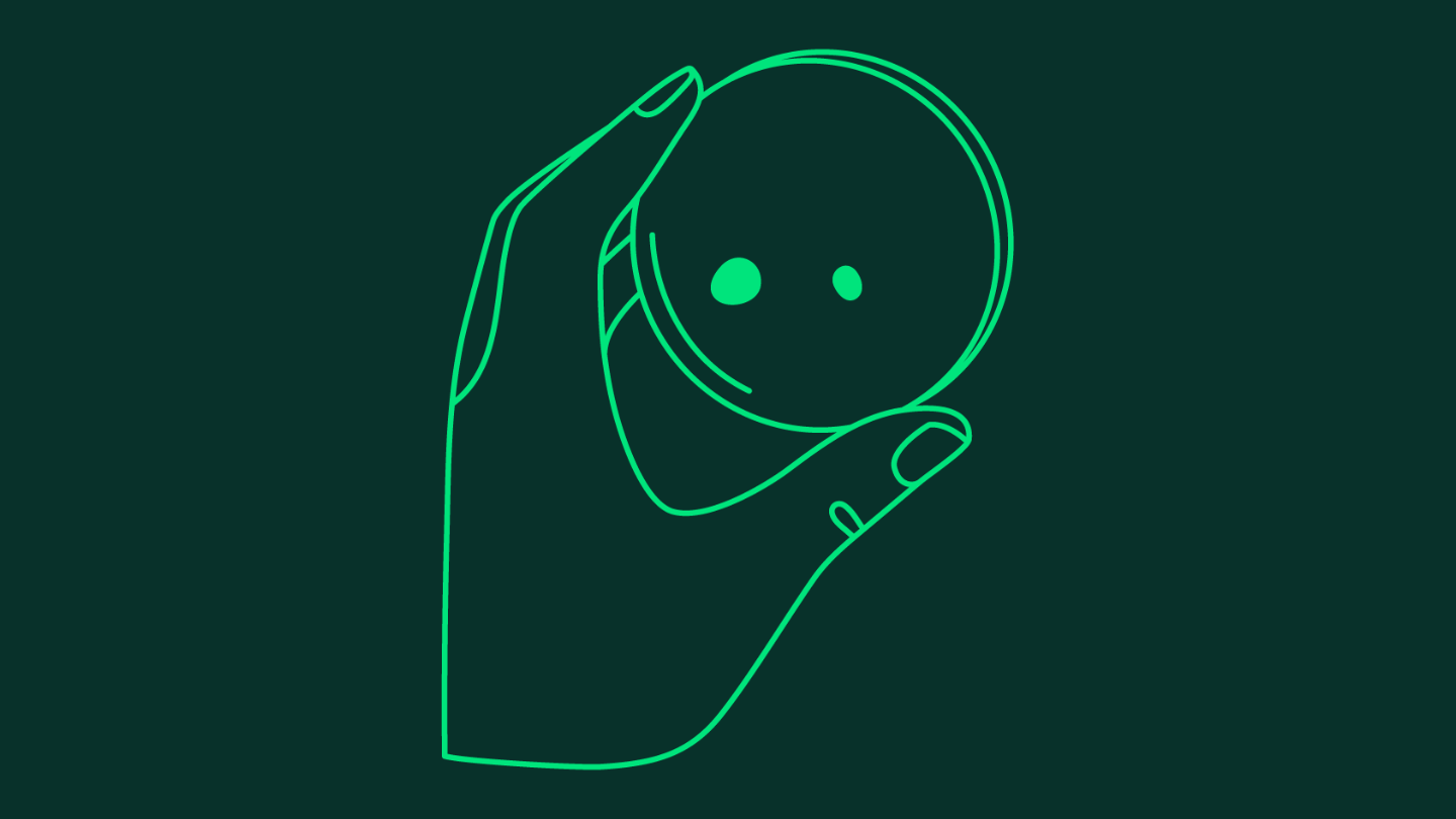 An illustration in light green of a hand holding a petri dish on a dark green background.