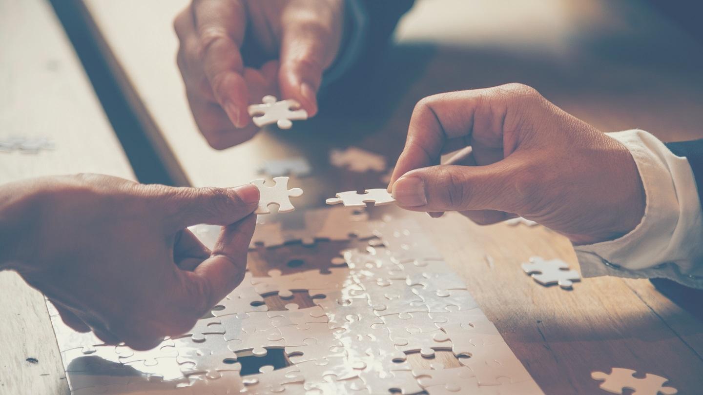 People putting together a puzzle