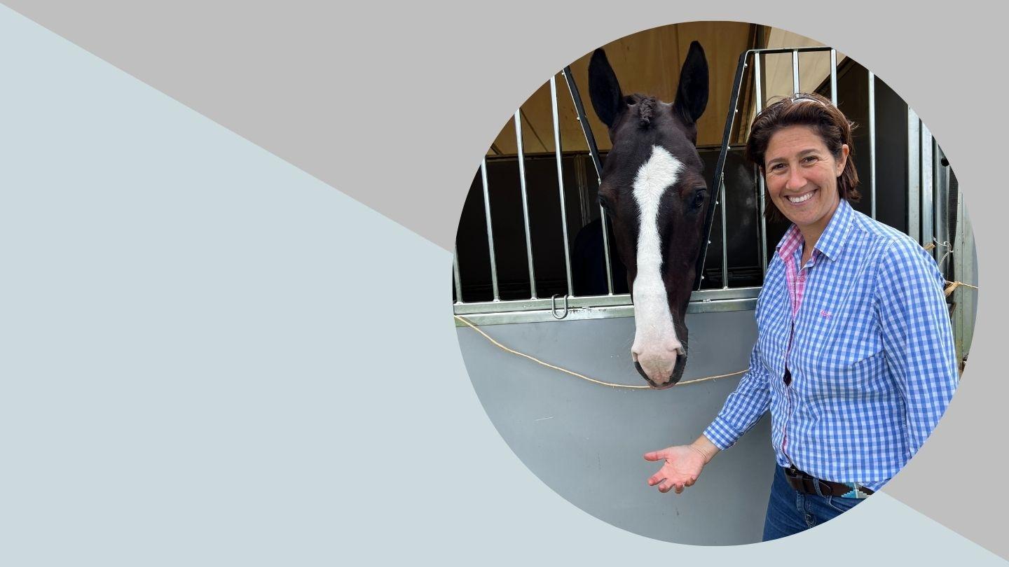 Lucy Katan in a stable with a horse